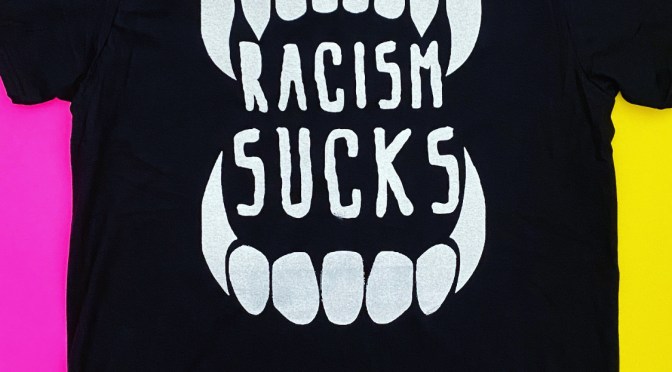 Racism Sucks – Fangs Tee Fundraiser for NAACP Legal Defense Fund